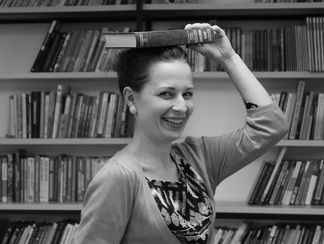 [Picture of woman happy to have a book to read]