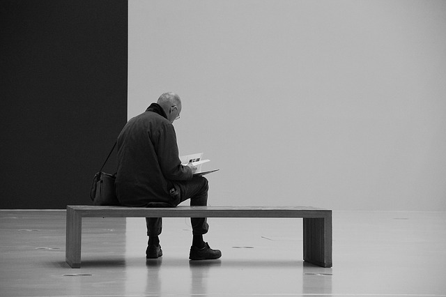 [Picture of man reading a book]